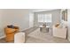 Cozy living room featuring a stylish seating arrangement and a large window for natural light at 1920 E Edgewood Dr # A5, Lakeland, FL 33803