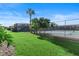 Exterior shot of a well-maintained tennis court surrounded by lush greenery at 1920 E Edgewood Dr # A5, Lakeland, FL 33803