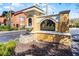 Elegant entrance to Mirabella Luxury Condominium Residences with a decorative fountain and distinguished signage at 19914 Villa Creek Dr # 105, Orlando, FL 32821