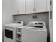 Convenient laundry area with washer, dryer and plenty of cabinet storage at 19914 Villa Creek Dr # 105, Orlando, FL 32821