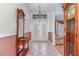 Home foyer featuring tile floors, a mirror and cabinet, and an antique grandfather clock at 2029 Majestic Elm Blvd, Ocoee, FL 34761