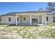 Home backyard showcasing a spacious covered patio perfect for outdoor entertaining and relaxation at 216 Homewood Dr, Sanford, FL 32773