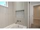 Elegant bathroom featuring a bathtub with custom tile accents and a built-in mosaic niche at 216 Homewood Dr, Sanford, FL 32773