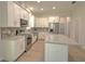 Bright kitchen boasting stainless steel appliances, center island, and white cabinets at 216 Homewood Dr, Sanford, FL 32773