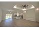 Open-concept living room showcasing recessed lighting and a kitchen in the background at 216 Homewood Dr, Sanford, FL 32773