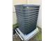 Exterior AC unit showing protective fins over working elements, installed on a concrete pad at 2165 Leather Fern Dr, Ocoee, FL 34761