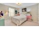 Charming bedroom with a bed, side tables, and decorative lamps at 2165 Leather Fern Dr, Ocoee, FL 34761