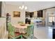 Bright dining area with a decorative table and chairs, seamlessly connected to the modern kitchen at 2165 Leather Fern Dr, Ocoee, FL 34761