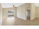 Living room featuring light-tone wood floors, ceiling fan, and sliding glass doors to the yard at 237 Clarinet Way, Davenport, FL 33896