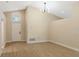 Front living room featuring light-tone wood floors, modern light fixture, and entrance at 237 Clarinet Way, Davenport, FL 33896