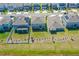 Aerial view of the neighborhood featuring houses with well-maintained lawns in a Primary-planned community at 3005 Slough Creek Dr, Kissimmee, FL 34744