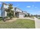 Charming two-story home boasts a well-manicured lawn and a brick-paved driveway at 3005 Slough Creek Dr, Kissimmee, FL 34744