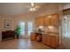 Bright breakfast nook featuring a built-in desk area, ample cabinet space, and access to the outdoors at 31707 Orange St, Sorrento, FL 32776