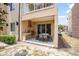 Covered patio with outdoor kitchen, stone counters, dining table and natural surroundings at 3191 Brasilia Ave, Kissimmee, FL 34747