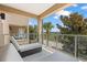 Relaxing balcony featuring patio furniture and views of the community landscape at 3191 Brasilia Ave, Kissimmee, FL 34747
