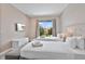 Bright bedroom featuring two double beds, soft carpet and a large window offering natural light at 3191 Brasilia Ave, Kissimmee, FL 34747