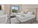 Bright and inviting bedroom with two comfortable beds, soft carpet, and natural light, providing a relaxing atmosphere at 3191 Brasilia Ave, Kissimmee, FL 34747