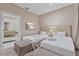 Comfortable bedroom with two beds, a flat-screen TV, and an ensuite bathroom, providing a private and relaxing space at 3191 Brasilia Ave, Kissimmee, FL 34747