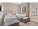 Cozy bedroom with two twin beds, soft carpeting, and stylish decor, perfect for guests at 3191 Brasilia Ave, Kissimmee, FL 34747