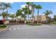 Gated community entrance with modern design and well-maintained landscaping at 3191 Brasilia Ave, Kissimmee, FL 34747