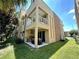 Beautiful home exterior with a built-in outdoor kitchen and a balcony on the second level, great curb appeal at 3191 Brasilia Ave, Kissimmee, FL 34747