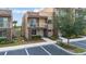 Modern condo featuring a private balcony, neutral-toned exterior, and well-maintained landscaping at 3191 Brasilia Ave, Kissimmee, FL 34747
