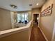 Upstairs hallway with modern chandelier, carpet and view to the outside balcony at 3191 Brasilia Ave, Kissimmee, FL 34747