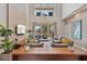 Bright living room featuring high ceilings, modern furniture, and view to the outdoor patio at 3191 Brasilia Ave, Kissimmee, FL 34747