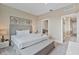 Serene main bedroom with a king-size bed, soft lighting, and elegant decor, offering a relaxing retreat at 3191 Brasilia Ave, Kissimmee, FL 34747