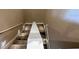 Carpeted staircase with white banister and recessed lighting leading to upper level at 3191 Brasilia Ave, Kissimmee, FL 34747