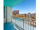 Balcony view of a community pool and lounge area with city buildings in the background at 322 E Central Blvd # 606, Orlando, FL 32801