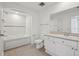 Well-appointed bathroom with a tub, toilet, and vanity with sink at 322 E Central Blvd # 606, Orlando, FL 32801