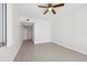 Bright bedroom featuring light wood-look flooring, neutral walls, closet, and ceiling fan at 322 E Central Blvd # 606, Orlando, FL 32801