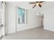 Sunlit bedroom with light wood-look floors, a ceiling fan, and neutral walls, creating a serene and modern space at 322 E Central Blvd # 606, Orlando, FL 32801