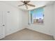 Cozy bedroom with light flooring and a bright window view at 322 E Central Blvd # 606, Orlando, FL 32801