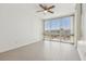 Sun-filled bedroom with large windows and laminate flooring at 322 E Central Blvd # 606, Orlando, FL 32801