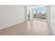 Bright, airy living room with wood floors and a large window offering city views at 322 E Central Blvd # 606, Orlando, FL 32801