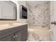 Bathroom featuring a marble tiled wall, vanity and bathtub at 3357 Shalimar Cir, Deltona, FL 32738