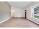 Bright and airy living room features light-colored vinyl flooring and fresh, neutral paint at 3357 Shalimar Cir, Deltona, FL 32738