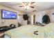 Bedroom with a bed, ceiling fan, and a wall-mounted television at 3708 Pipes O The Glen Way, Orlando, FL 32808