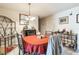 Cozy dining room featuring metal table and chairs, tile flooring, and a decorative wine rack at 3708 Pipes O The Glen Way, Orlando, FL 32808