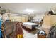 View of cluttered garage interior with miscellaneous items, concrete floor, and sectional garage door at 3708 Pipes O The Glen Way, Orlando, FL 32808