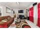 Living room featuring tile flooring and a large television at 3708 Pipes O The Glen Way, Orlando, FL 32808