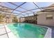 A beautiful screened-in pool surrounded by a well-maintained patio area at 3708 Pipes O The Glen Way, Orlando, FL 32808