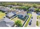 Aerial view of the backyard shows the screened-in pool and patio with a white vinyl fence around the perimeter at 4655 Ross Lanier Ln, Kissimmee, FL 34758