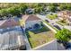 Aerial view of a backyard featuring a gazebo, green grass, and surrounding fences at 4655 Ross Lanier Ln, Kissimmee, FL 34758