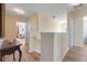 The upstairs hallway offers seamless access to various rooms with hardwood flooring at 4655 Ross Lanier Ln, Kissimmee, FL 34758