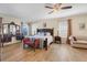 Bright main bedroom with a dark wood furniture set, soft accents, and a ceiling fan at 4655 Ross Lanier Ln, Kissimmee, FL 34758