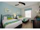 Cozy bedroom with two twin beds, soft lighting, and colorful accents at 4814 Cayview Ave # 407, Orlando, FL 32819