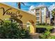 Vista Cay Resort signage with a well-maintained property and lush landscaping at 4814 Cayview Ave # 407, Orlando, FL 32819